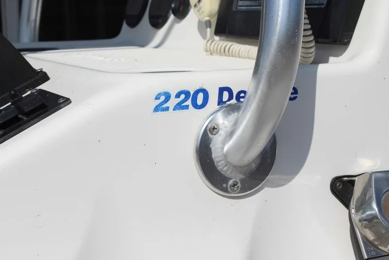 Slide: The Image of Close-up of 2002 Blue Wave 2200 DELUXE CC boat console with handle. - 15