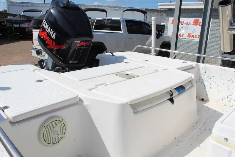 Slide: The Image of 2002 Blue Wave 2200 DELUXE CC boat with Yamaha VMAX engine, parked near a dealership. - 7