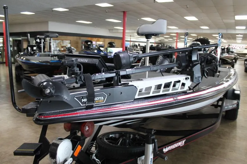 Slide: The Image of 2024 Phoenix 921 ELITE boat with Minn Kota Ultrex motor in showroom. - 10
