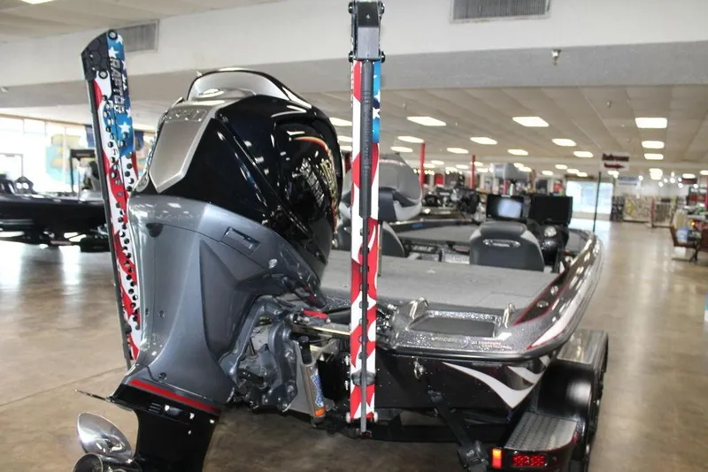 Slide: The Image of 2024 Phoenix 921 ELITE boat displayed indoors, showcasing powerful engine and sleek design. - 3