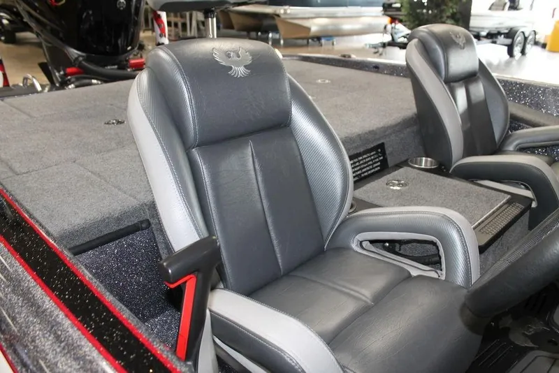 Slide: The Image of 2024 Phoenix 921 ELITE boat interior with gray leather seats and cup holders. - 4