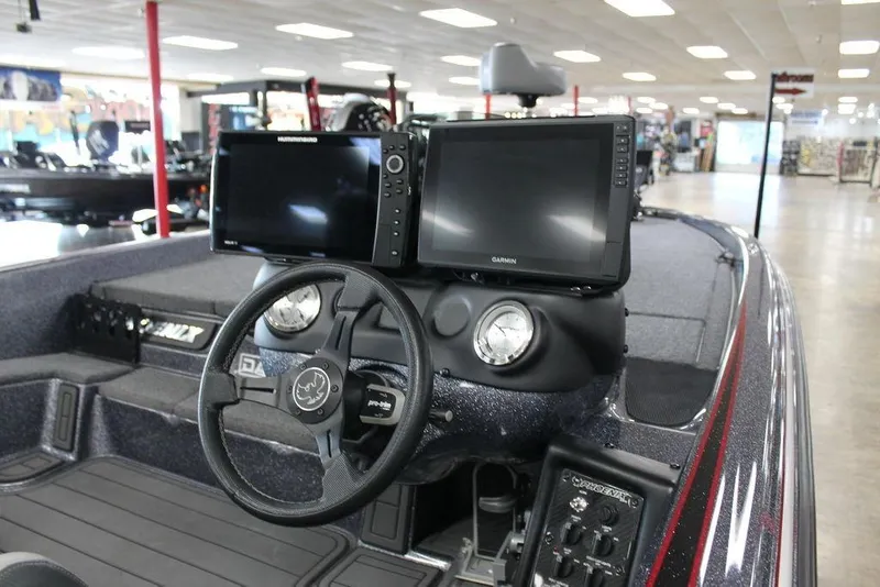 Slide: The Image of 2024 Phoenix 921 ELITE boat dashboard with dual monitors and steering wheel. - 5