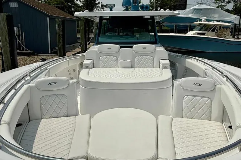 Slide: The Image of Luxurious 2025 HCB 48 Campeon boat interior with white quilted seating. - 10