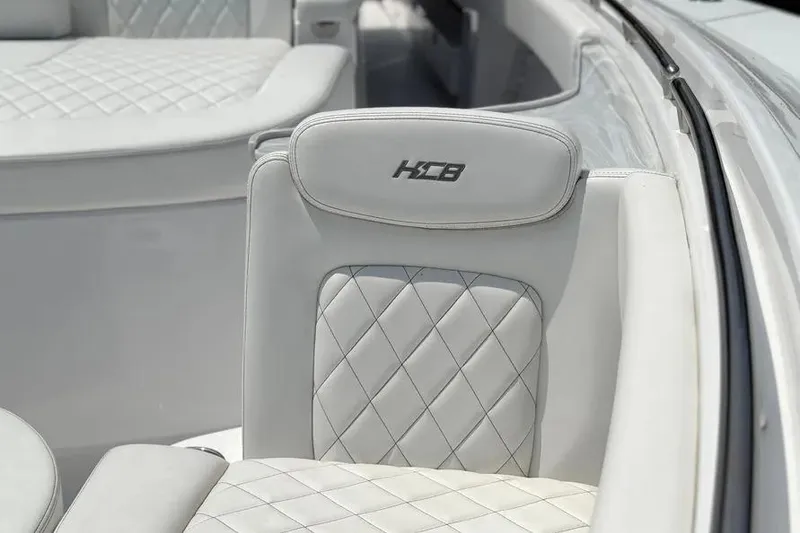Slide: The Image of Luxurious seating on 2025 HCB 48 Campeon boat with diamond stitching. - 15