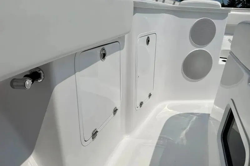 Slide: The Image of 2025 HCB 48 Campeon boat interior with storage compartments and sleek design. - 18
