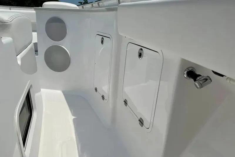 Slide: The Image of 2025 HCB 48 Campeon boat interior with storage compartments and sleek design. - 21