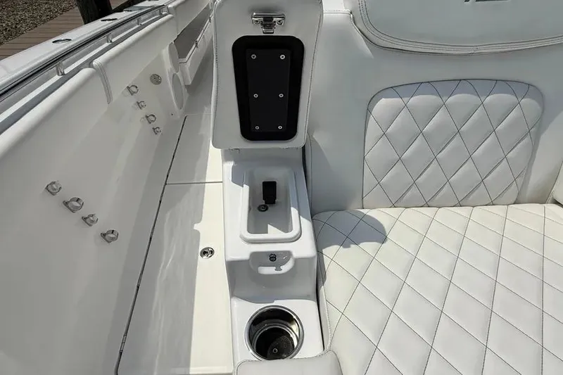 Slide: The Image of Luxurious interior of 2025 HCB 48 Campeon boat with quilted white seating. - 24