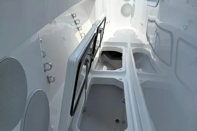 Slide: The Image of Interior view of 2025 HCB 48 Campeon boat, showcasing storage compartments. - 25