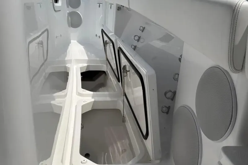 Slide: The Image of Interior view of 2025 HCB 48 Campeon boat, featuring sleek storage compartments. - 27