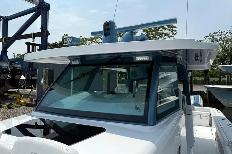 Slide: The Image of 2025 HCB 48 Campeon boat with advanced navigation equipment and sleek design. - 28