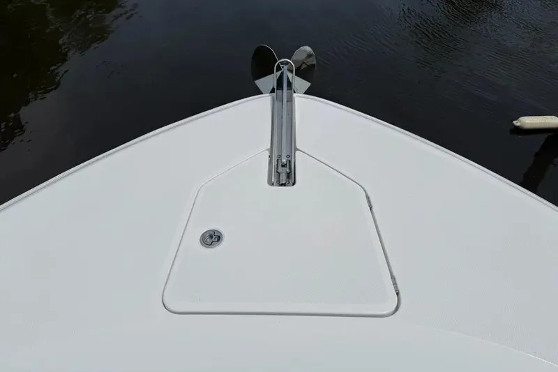 Slide: The Image of Bow of 2025 HCB 48 Campeon boat with anchor, on calm water. - 4