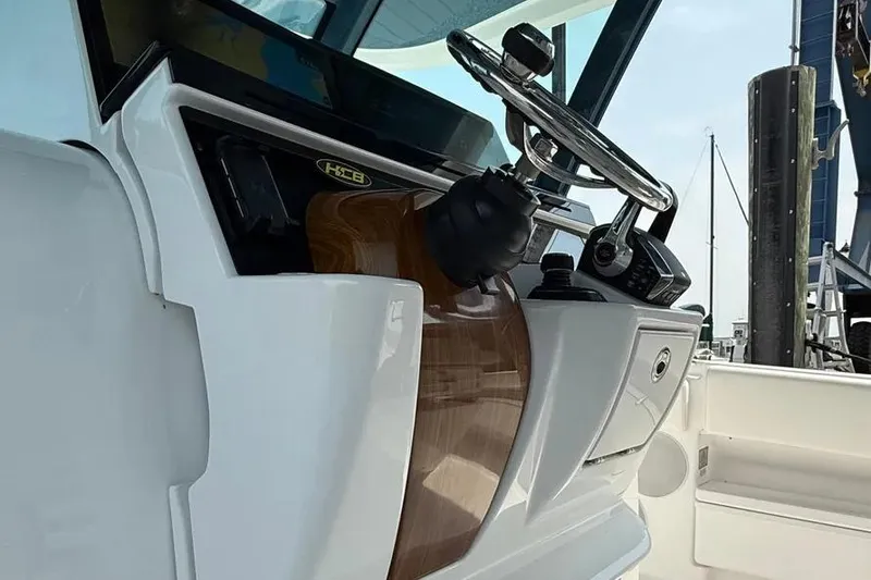 Slide: The Image of Helm of 2025 HCB 48 Campeon boat with sleek design and modern controls. - 45