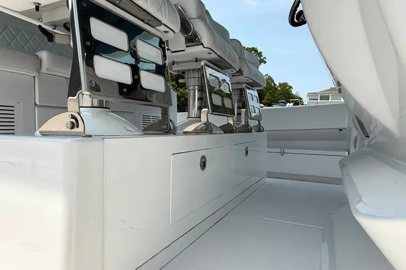 Slide: The Image of Interior view of 2025 HCB 48 Campeon boat, featuring sleek seating and storage compartments. - 48