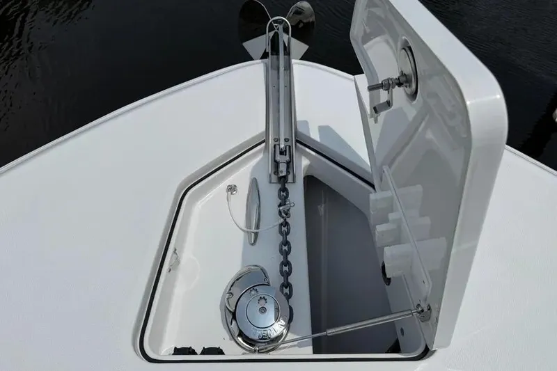 Slide: The Image of Anchor compartment of 2025 HCB 48 Campeon boat, featuring chain and winch system. - 5