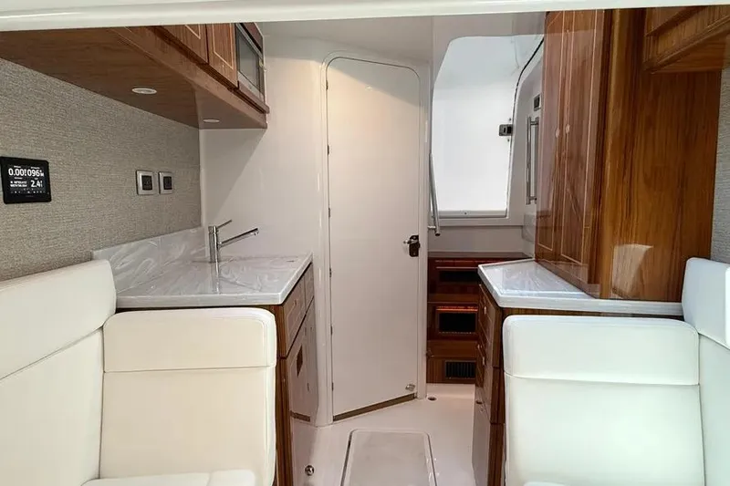 Slide: The Image of Luxurious interior of 2025 HCB 48 Campeon yacht with modern furnishings and wood accents. - 52