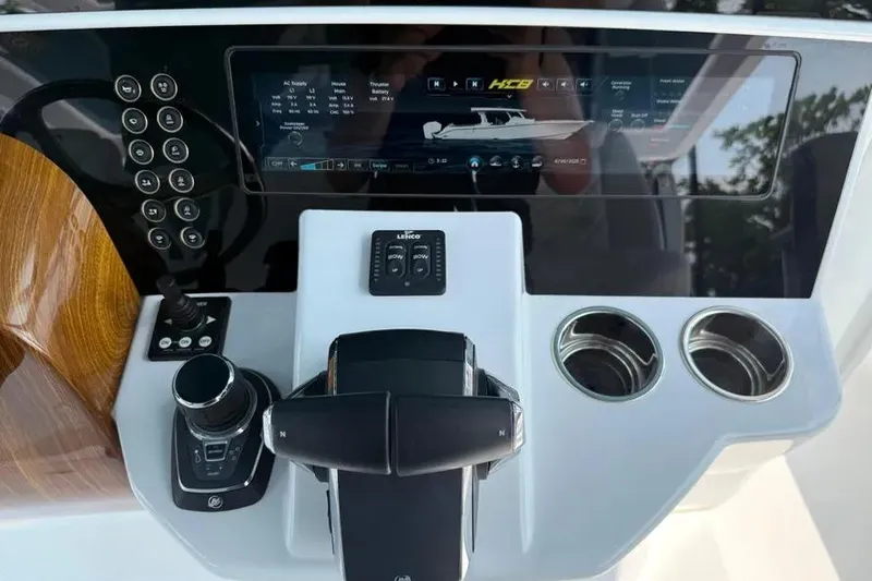 Slide: The Image of Control panel of 2025 HCB 48 Campeon boat with touchscreen and controls. - 55