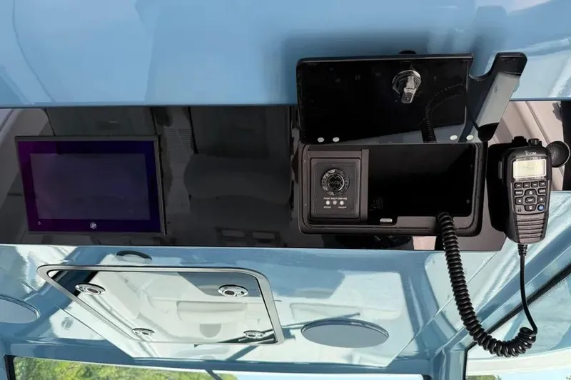 Slide: The Image of 2025 HCB 48 Campeon boat dashboard with communication equipment and control panel. - 57