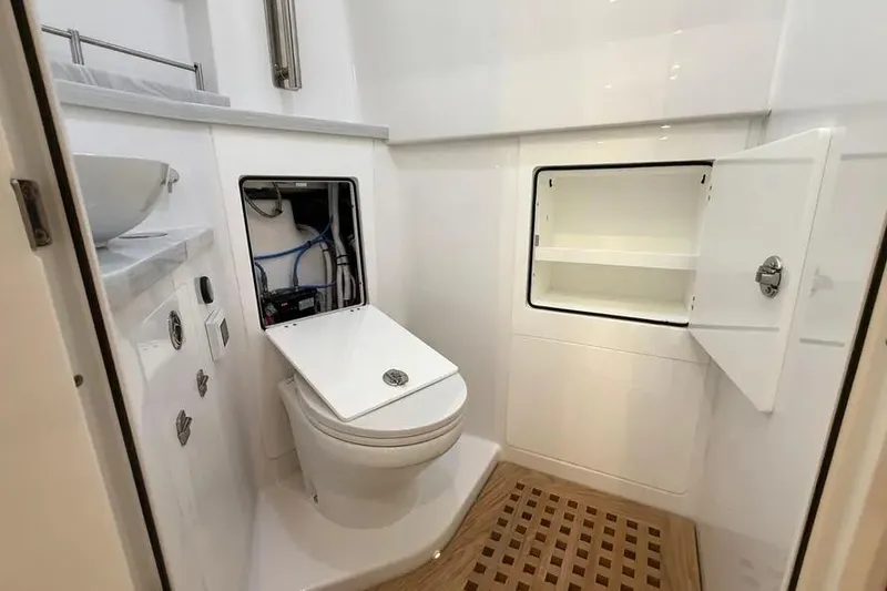 Slide: The Image of 2025 HCB 48 Campeon yacht bathroom with modern fixtures and storage compartments. - 62