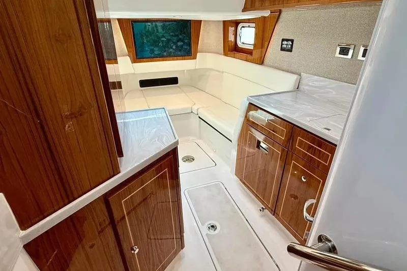 Slide: The Image of Luxurious interior of 2025 HCB 48 Campeon yacht with wood cabinetry and white seating. - 68