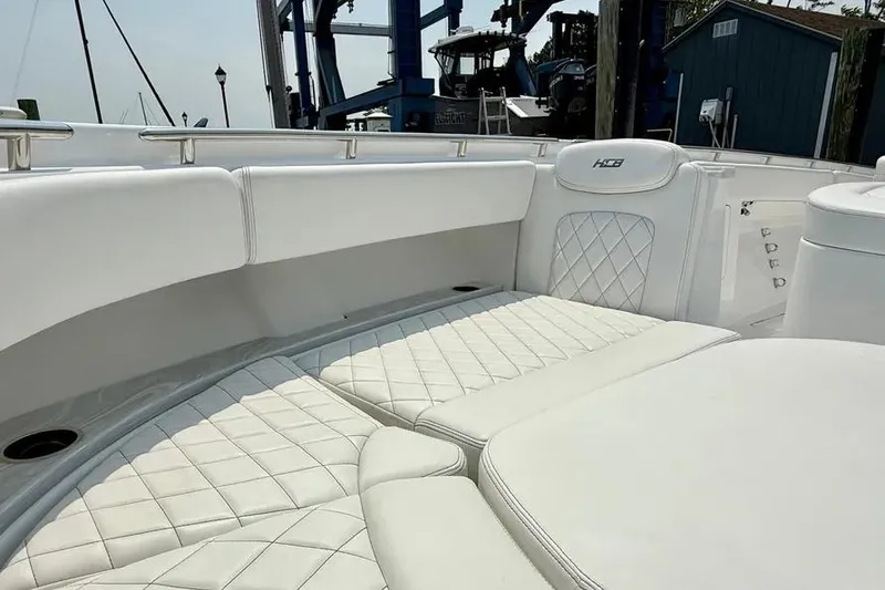 Slide: The Image of Luxurious seating on 2025 HCB 48 Campeon boat with quilted white upholstery. - 7