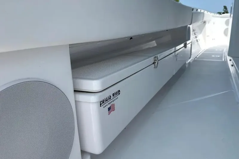 Slide: The Image of 2025 HCB 48 Campeon boat interior with storage compartment and speaker. - 72