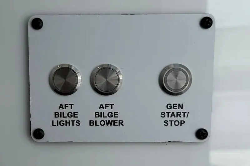 Slide: The Image of Control panel of HCB 48 Campeon 2025 with bilge lights, blower, and generator buttons. - 74