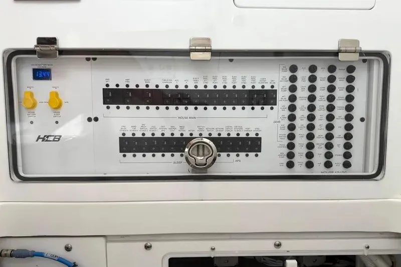 Slide: The Image of Control panel of 2025 HCB 48 Campeon boat with switches and digital display. - 81