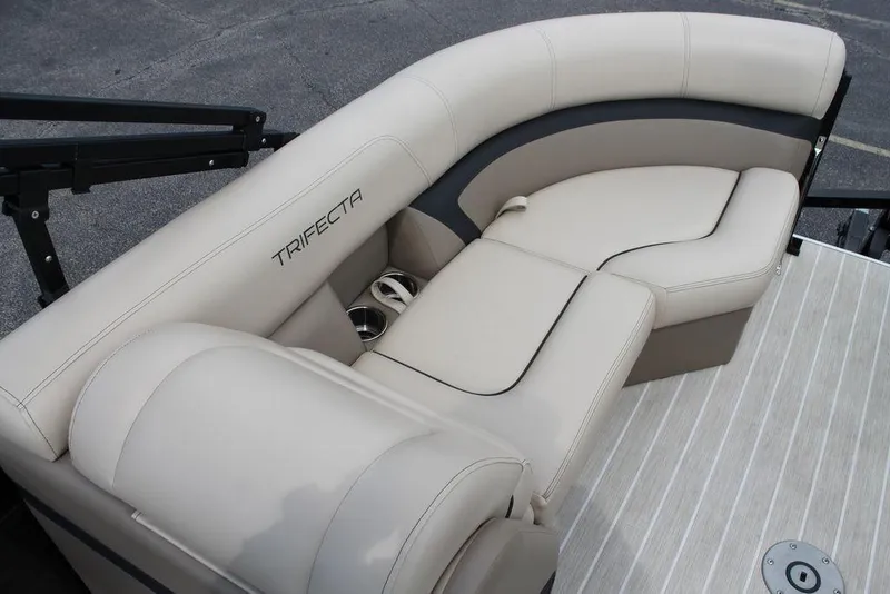 Slide: The Image of Luxurious seating on 2023 Trifecta 24UL-CS pontoon boat with beige upholstery and cup holders. - 15