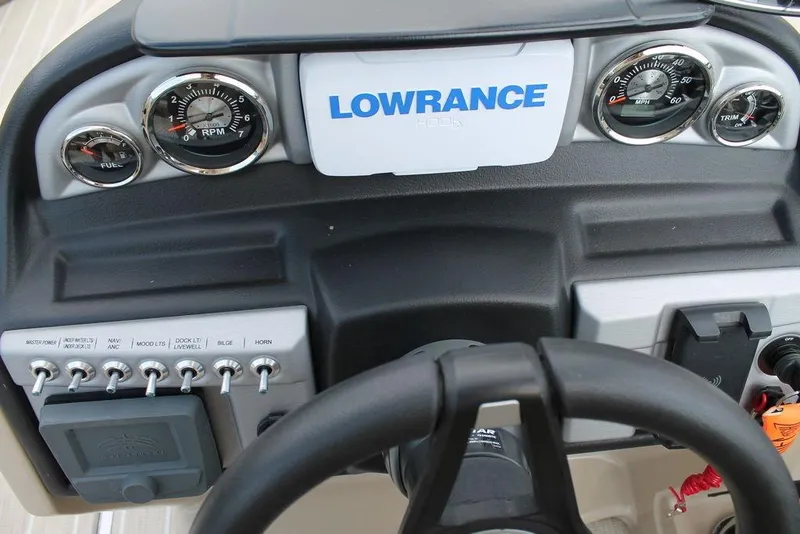 Slide: The Image of Dashboard of 2023 Trifecta 24UL-CS boat with gauges and Lowrance display. - 8