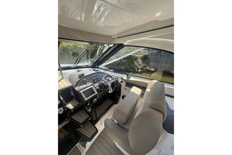 Slide: The Image of 2014 Regal 35 Sport Coupe cockpit with modern controls and comfortable seating. - 12