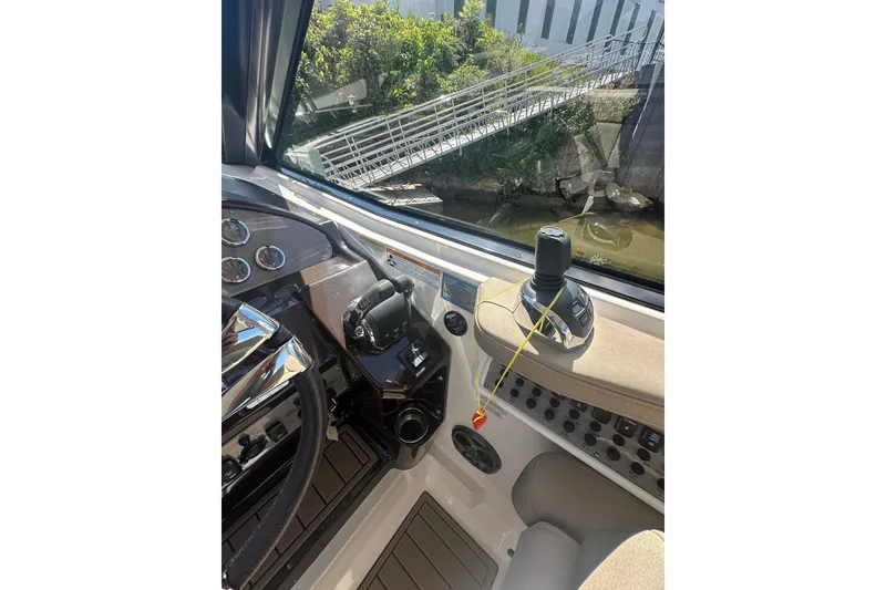 Slide: The Image of 2014 Regal 35 Sport Coupe helm with controls and dashboard view. - 17