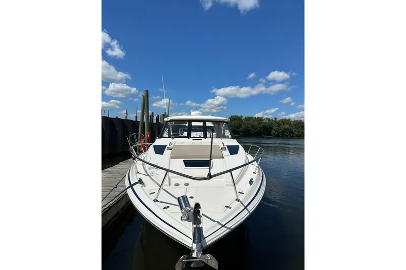 Slide: The Image of 2014 Regal 35 Sport Coupe docked on a sunny day with blue skies. - 4