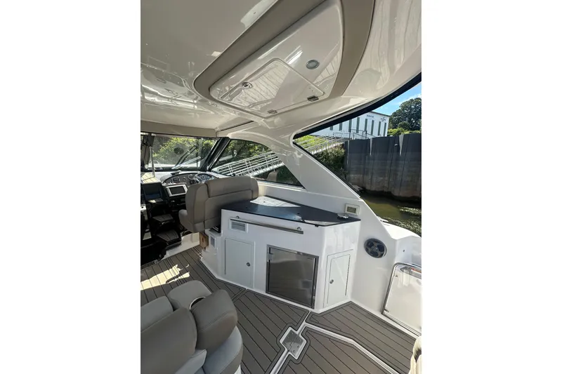 Slide: The Image of Interior of 2014 Regal 35 Sport Coupe yacht with modern seating and sleek design. - 9