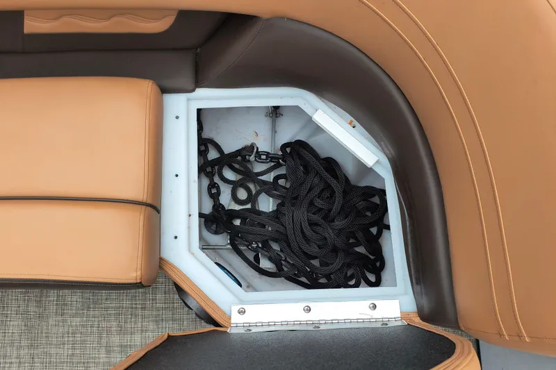 Slide: The Image of Storage compartment with black ropes in 2025 SunCatcher Fusion 324RC boat. - 15