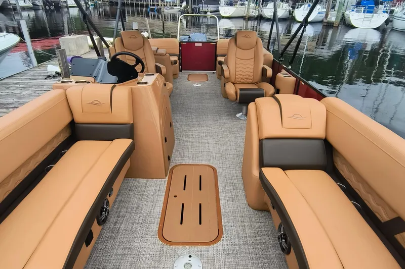 Slide: The Image of Luxurious interior of 2025 SunCatcher Fusion 324RC pontoon boat at marina. - 2
