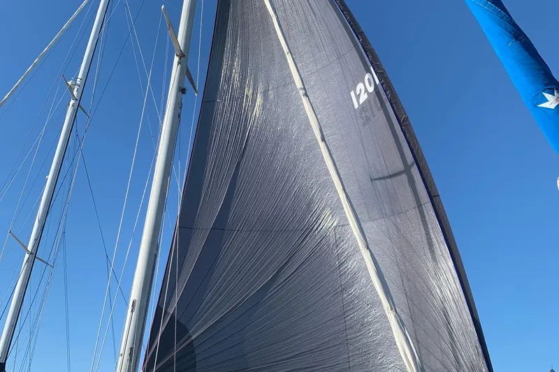 Slide: The Image of Sailboat with tall mast and sails against clear blue sky, Tartan 41, 1972 model. - 10