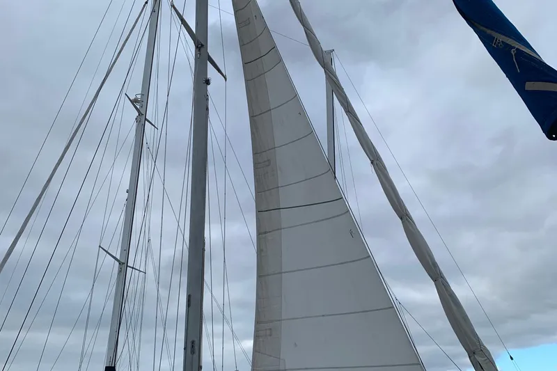 Slide: The Image of Sailboat mast and sails of a 1972 Tartan 41 under cloudy skies. - 12