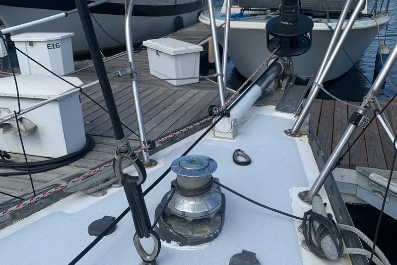 Slide: The Image of Deck of a 1972 Tartan 41 sailboat docked at a marina. - 15