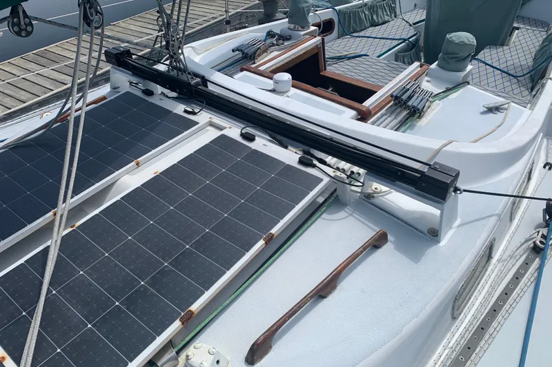 Slide: The Image of 1972 Tartan 41 sailboat deck with solar panels and rigging. - 16