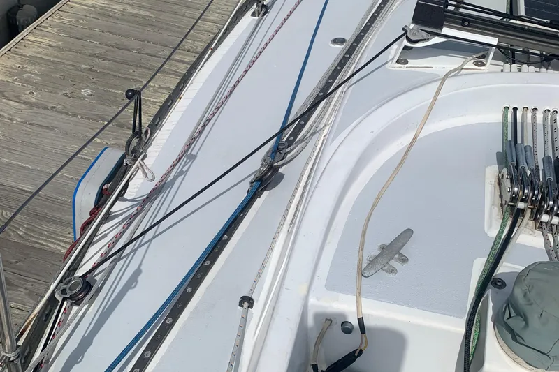 Slide: The Image of Deck of a 1972 Tartan 41 sailboat with rigging and dock. - 17