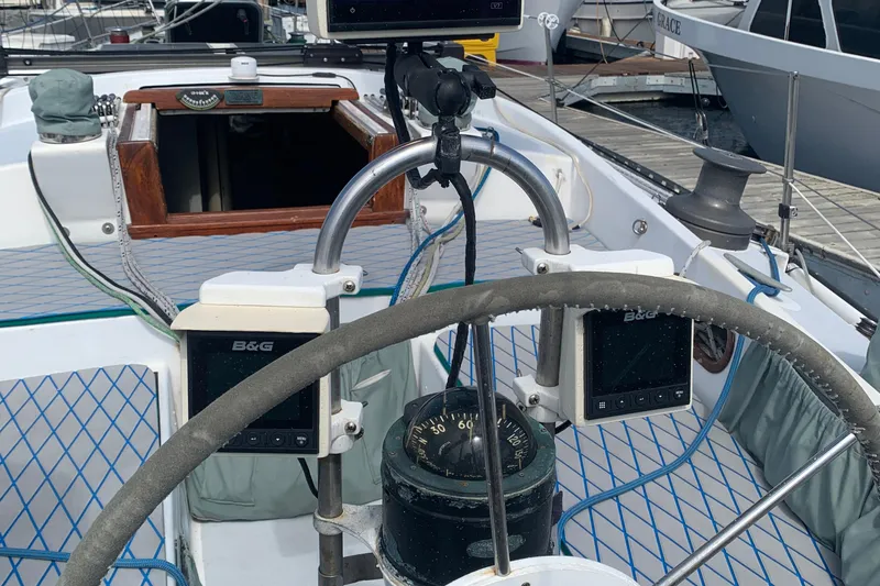 Slide: The Image of Cockpit of a 1972 Tartan 41 sailboat with navigation instruments and steering wheel. - 19