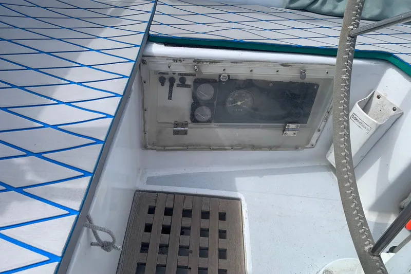 Slide: The Image of 1972 Tartan 41 sailboat cockpit with control panel and patterned deck. - 22