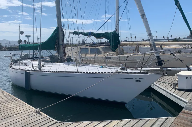 Slide: The Image of 1972 Tartan 41 sailboat docked at marina under clear blue sky. - 3