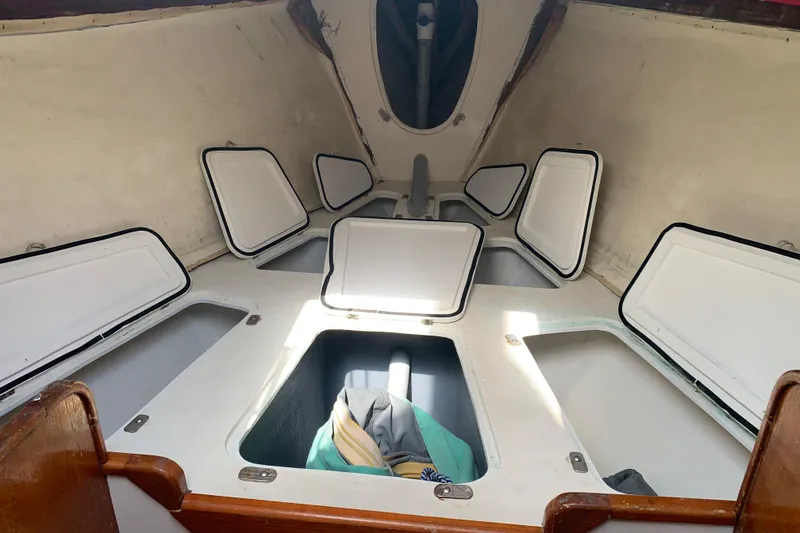 Slide: The Image of Interior of a 1972 Tartan 41 sailboat with open storage compartments. - 31