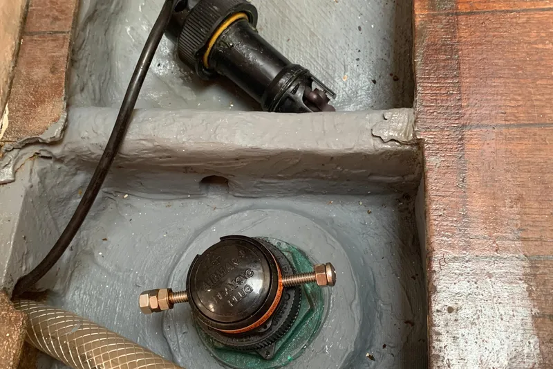 Slide: The Image of 1972 Tartan 41 boat interior showing mechanical components and wiring. - 33