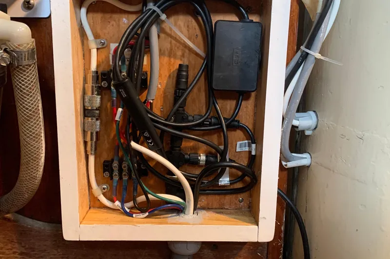 Slide: The Image of Electrical wiring inside a Tartan 41 sailboat, 1972 model, showcasing cables and connectors. - 40