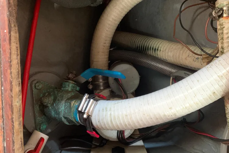 Slide: The Image of Engine compartment of a 1972 Tartan 41 sailboat with hoses and wiring. - 48