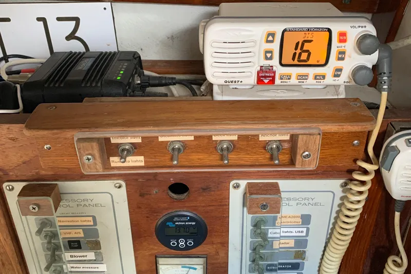 Slide: The Image of Control panel of a 1972 Tartan 41 sailboat with radio and switches. - 58