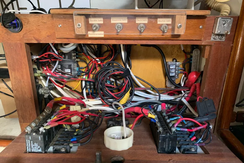 Slide: The Image of Electrical panel of a 1972 Tartan 41 sailboat with wiring and switches. - 59