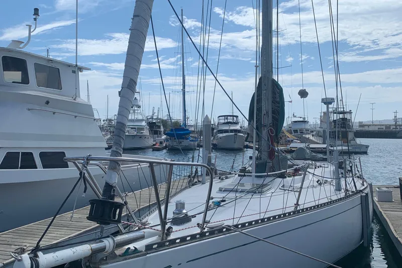 Slide: The Image of Sailboat docked at marina, Tartan 41 model, 1972, surrounded by other boats. - 6